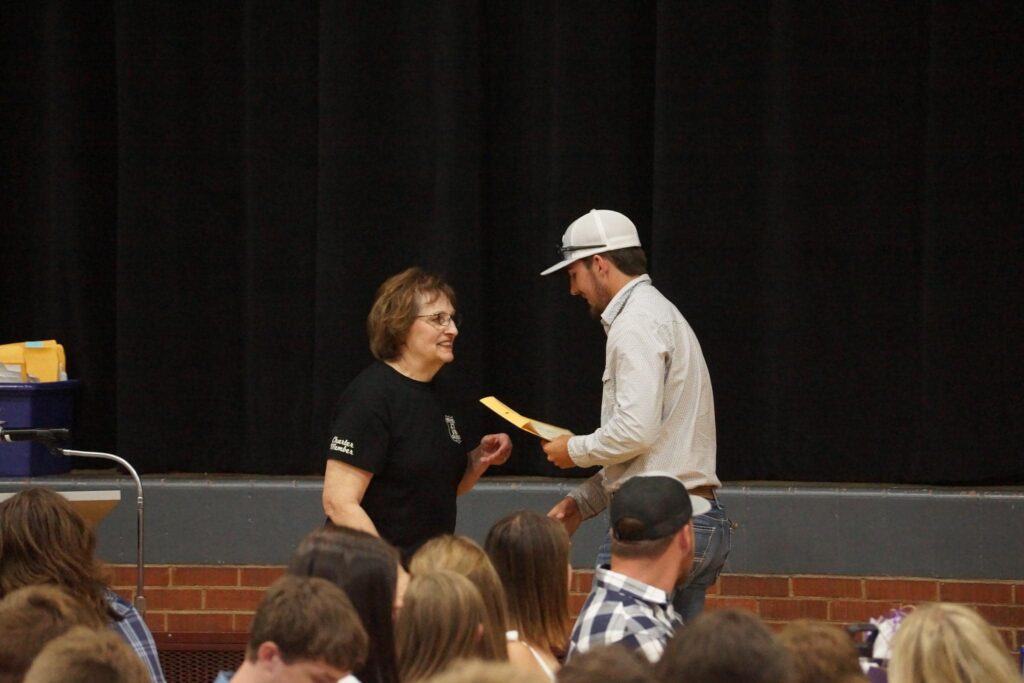 Tyler Stoddard receiving the 2023 JCT 6/10 Cruzerz $250 scholarship in memory of Myron Morris.